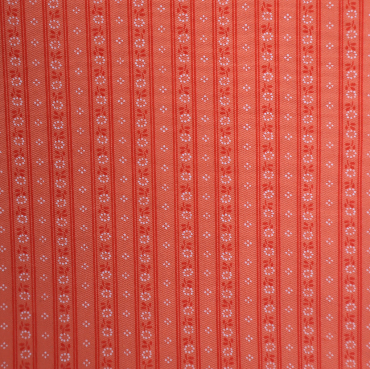 orange tendrils checkered dots apron fabric